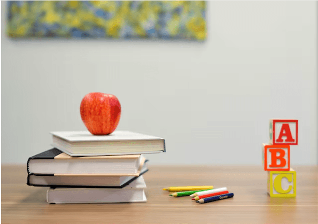 Premium educational desk with expert-curated Vedamrita Yoga Notes for lifelong learning